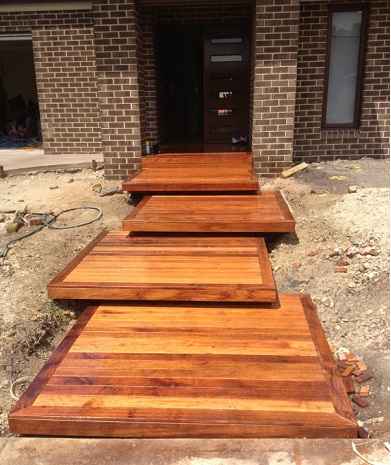 Timber deck with an outdoor table overlooking the hills