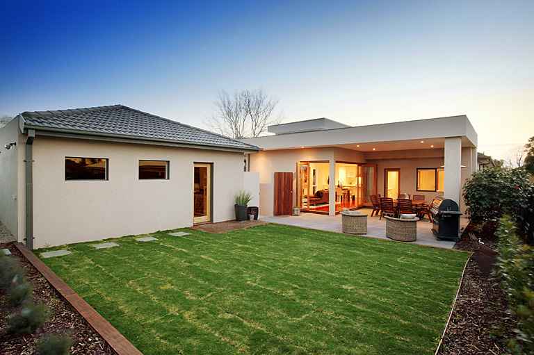 Sliding doors opening from a home onto a new timber deck