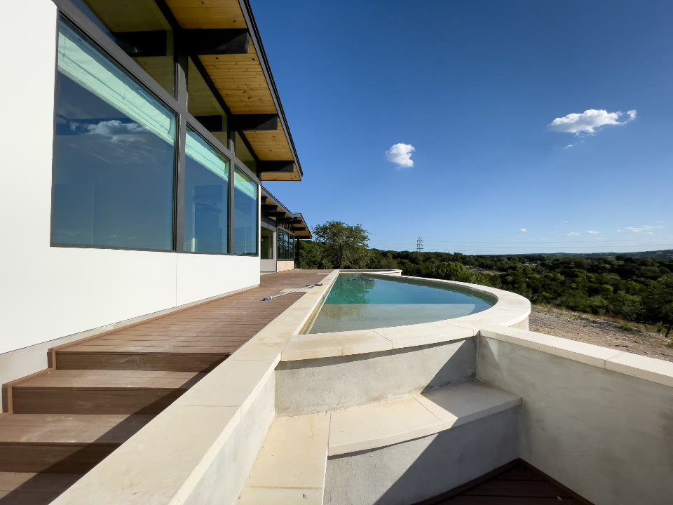 Finished home terrace with timber decking and pool